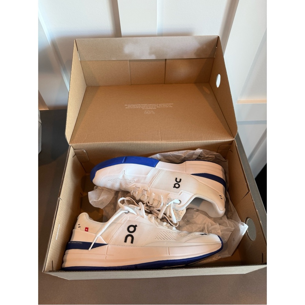 On Running Blue and White Athletic Shoes with Cloud Cushioning